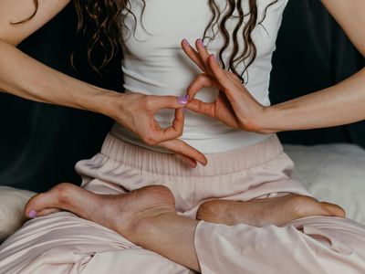Close-up of hands in a specific yoga mudra.